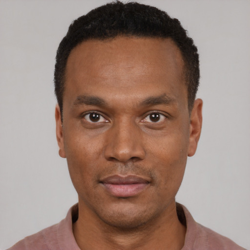 Neutral black young-adult male with short  black hair and brown eyes