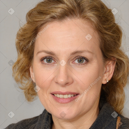 Joyful white adult female with medium  brown hair and blue eyes