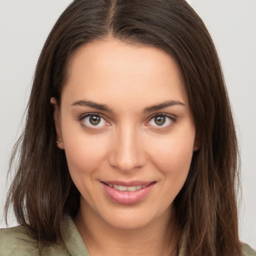 Joyful white young-adult female with medium  brown hair and brown eyes