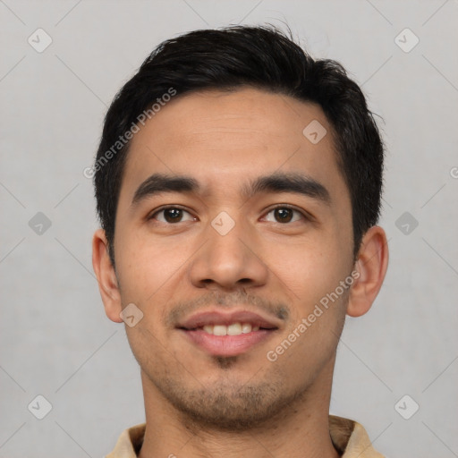 Joyful latino young-adult male with short  black hair and brown eyes