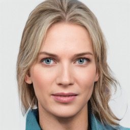 Joyful white young-adult female with medium  brown hair and blue eyes