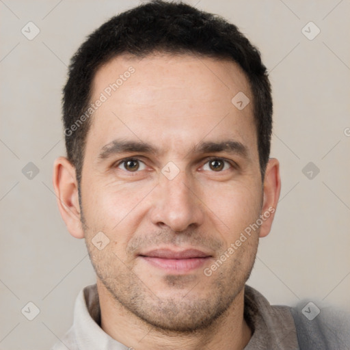 Joyful white young-adult male with short  brown hair and brown eyes