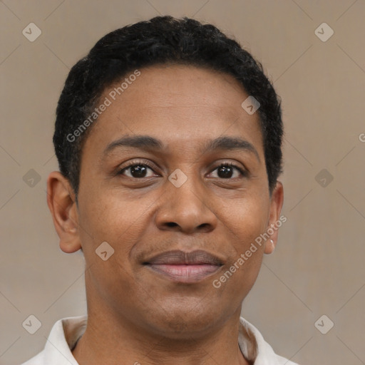 Joyful latino young-adult male with short  brown hair and brown eyes
