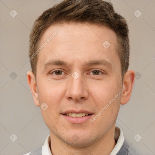 Joyful white adult male with short  brown hair and brown eyes