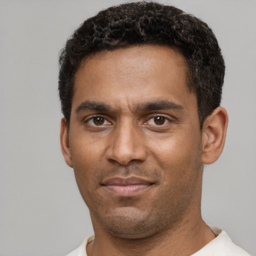 Neutral black young-adult male with short  black hair and brown eyes