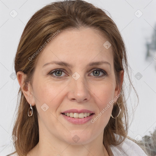 Joyful white adult female with medium  brown hair and grey eyes