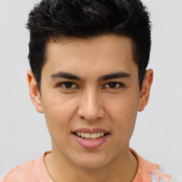 Joyful latino young-adult male with short  brown hair and brown eyes