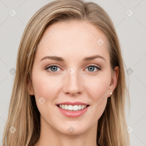 Joyful white young-adult female with long  brown hair and green eyes