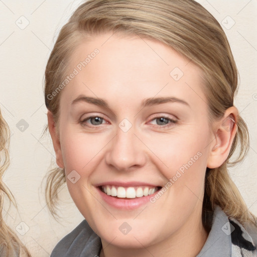 Joyful white young-adult female with medium  brown hair and blue eyes