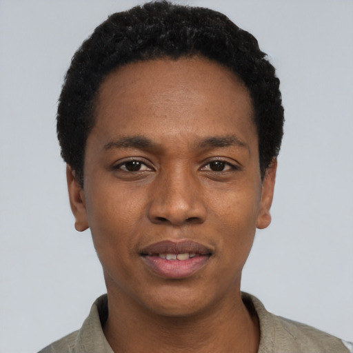 Joyful black young-adult male with short  black hair and brown eyes