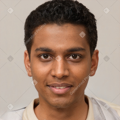 Joyful black young-adult male with short  brown hair and brown eyes