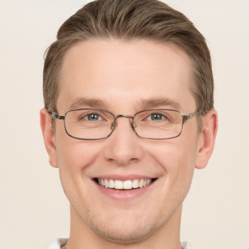 Joyful white adult male with short  brown hair and grey eyes