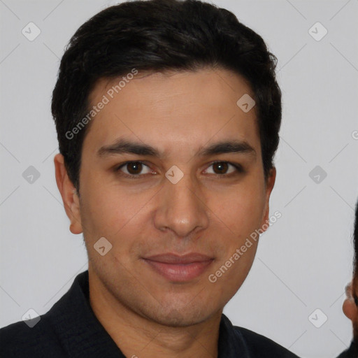 Joyful white young-adult male with short  black hair and brown eyes