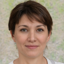 Joyful white adult female with medium  brown hair and brown eyes