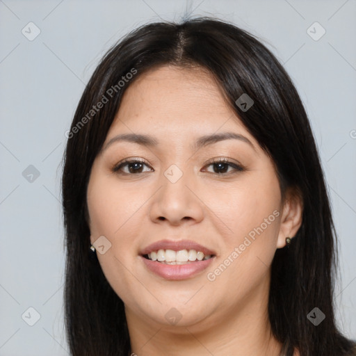 Joyful asian young-adult female with long  brown hair and brown eyes