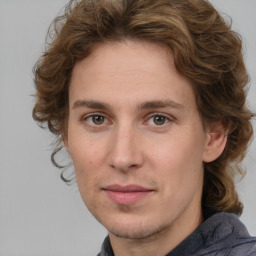 Joyful white young-adult male with medium  brown hair and brown eyes