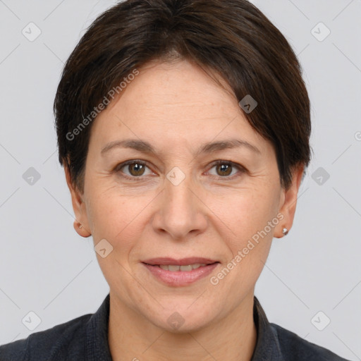 Joyful white adult female with short  brown hair and brown eyes