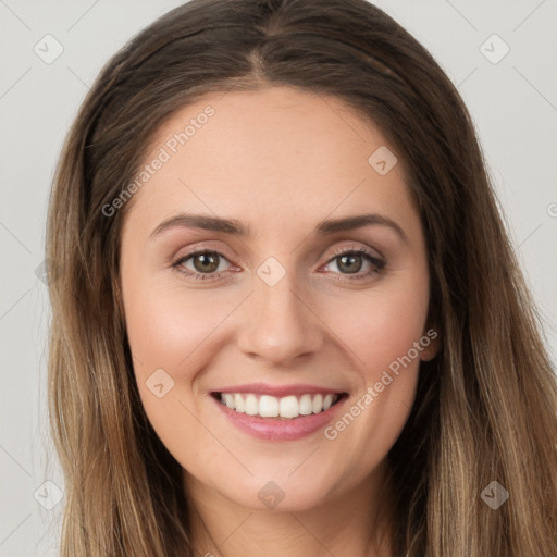 Joyful white young-adult female with long  brown hair and green eyes