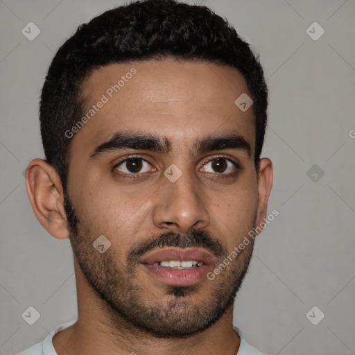 Joyful black young-adult male with short  black hair and brown eyes