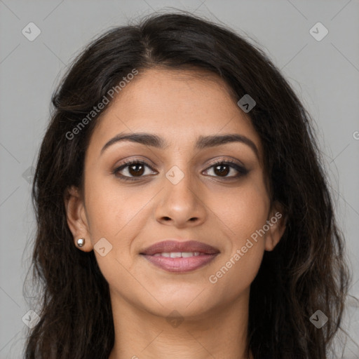 Joyful latino young-adult female with long  brown hair and brown eyes