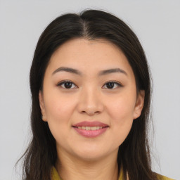 Joyful asian young-adult female with long  brown hair and brown eyes