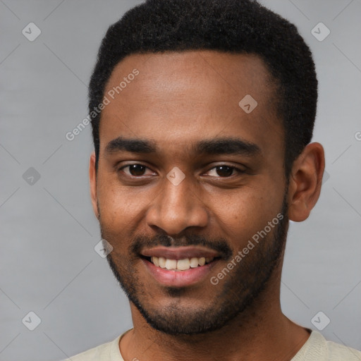 Joyful black young-adult male with short  brown hair and brown eyes