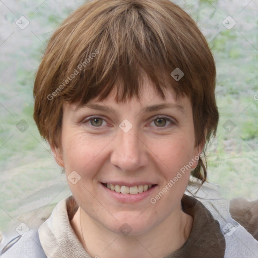 Joyful white young-adult female with medium  brown hair and blue eyes