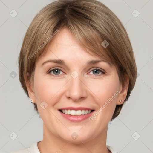 Joyful white adult female with medium  brown hair and grey eyes