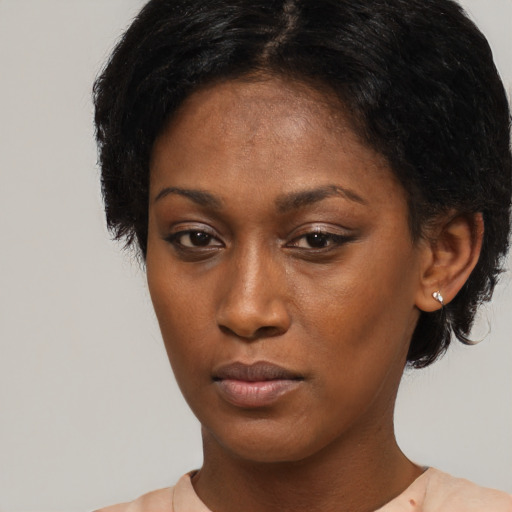 Neutral black young-adult female with short  black hair and brown eyes