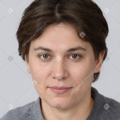 Joyful white adult female with short  brown hair and brown eyes