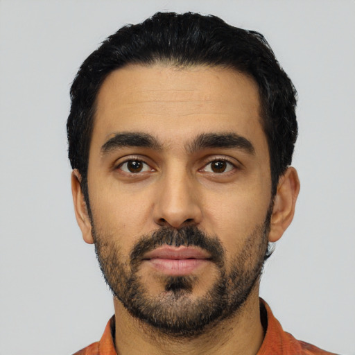 Neutral latino young-adult male with short  black hair and brown eyes