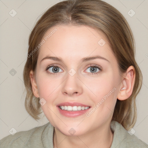 Joyful white young-adult female with medium  brown hair and blue eyes