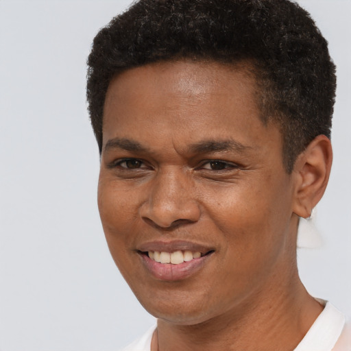 Joyful black young-adult male with short  brown hair and brown eyes