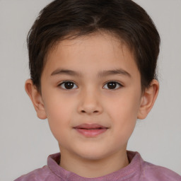 Joyful white child male with short  brown hair and brown eyes