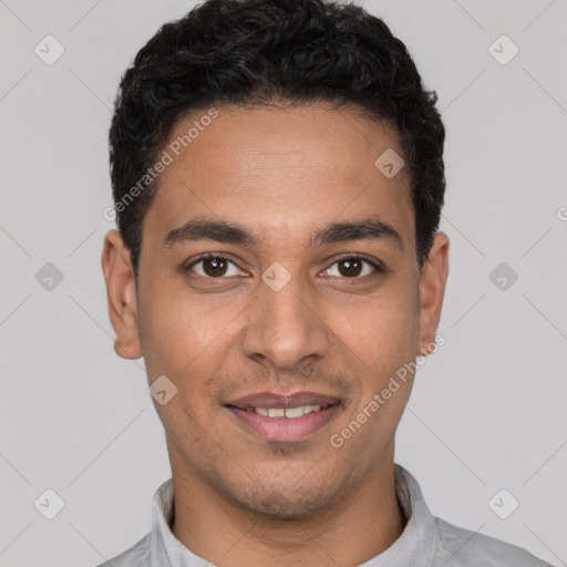 Joyful white young-adult male with short  black hair and brown eyes