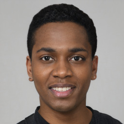 Joyful black young-adult male with short  black hair and brown eyes