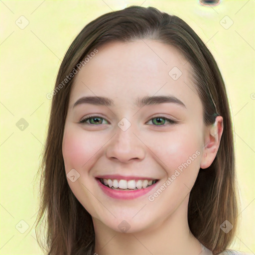 Joyful white young-adult female with long  brown hair and green eyes