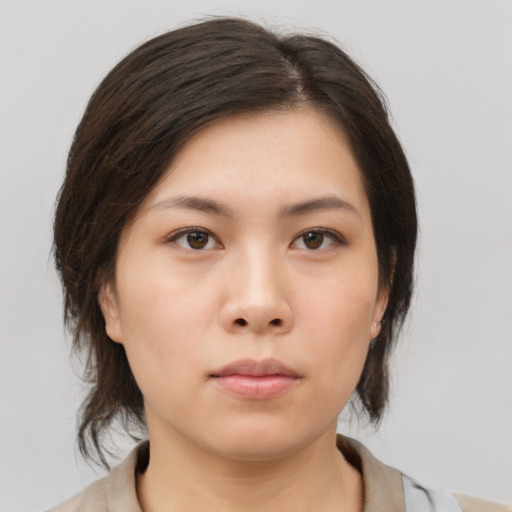 Neutral asian young-adult female with medium  brown hair and brown eyes
