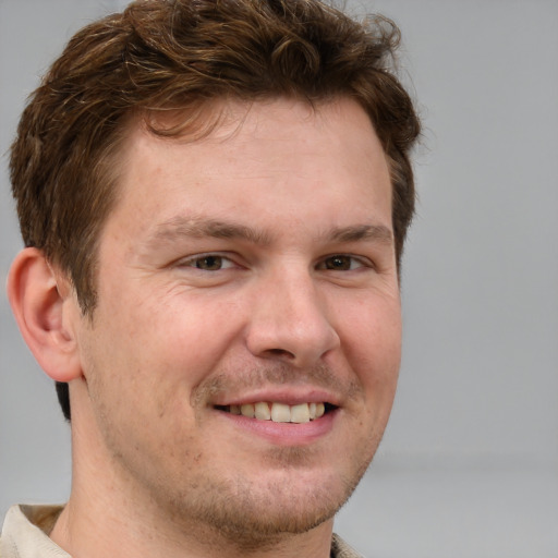 Joyful white adult male with short  brown hair and grey eyes