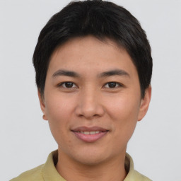 Joyful asian young-adult male with short  brown hair and brown eyes