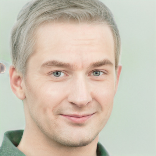 Joyful white adult male with short  brown hair and grey eyes