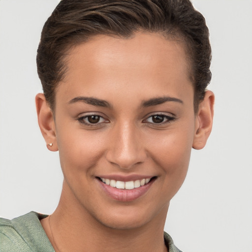 Joyful white young-adult female with short  brown hair and brown eyes