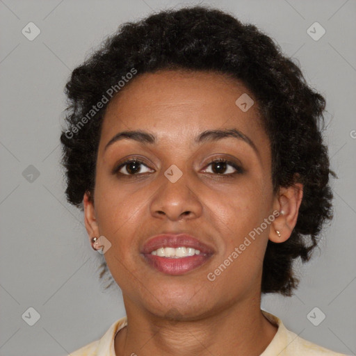 Joyful black adult female with short  brown hair and brown eyes