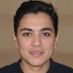 Joyful white young-adult male with short  black hair and brown eyes