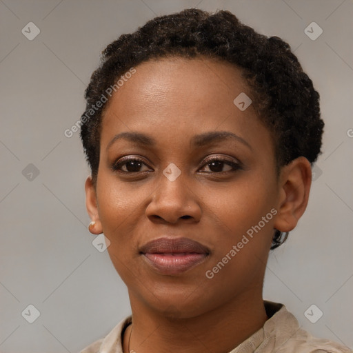 Joyful black young-adult female with short  brown hair and brown eyes