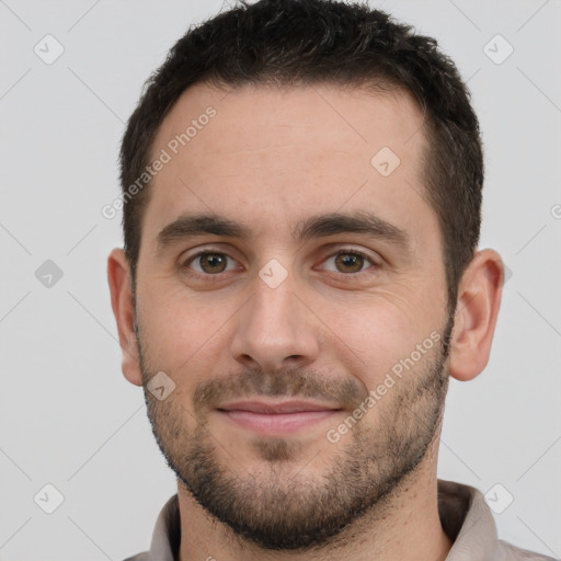 Joyful white young-adult male with short  brown hair and brown eyes