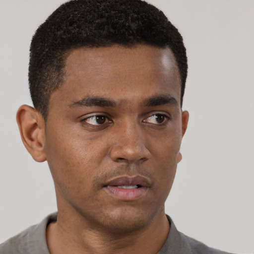 Neutral black young-adult male with short  brown hair and brown eyes