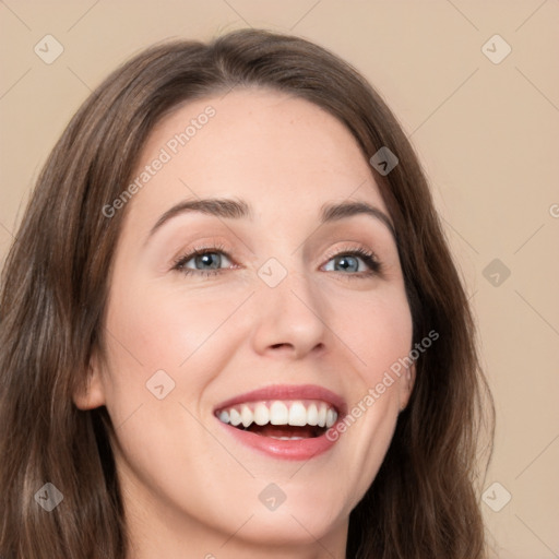 Joyful white young-adult female with long  brown hair and green eyes