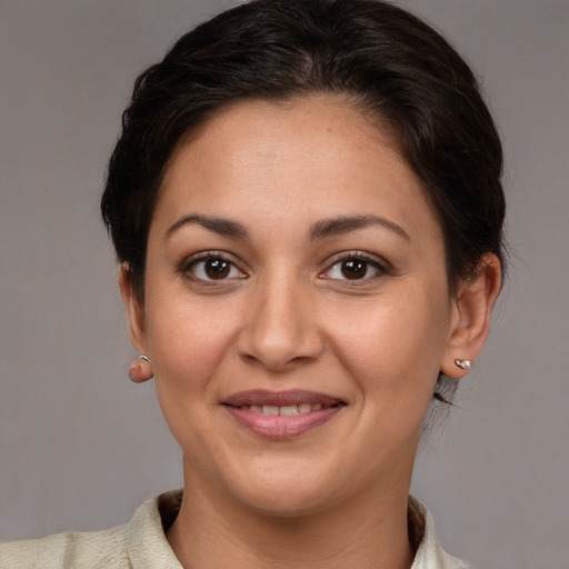 Joyful white adult female with short  brown hair and brown eyes