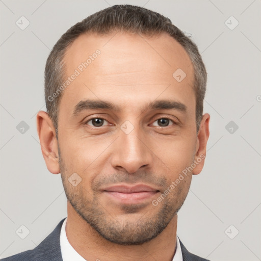 Joyful white adult male with short  brown hair and brown eyes